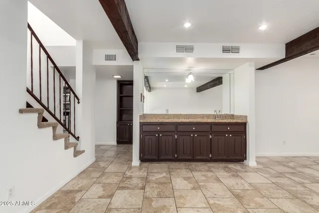 a view of empty room with a fireplace