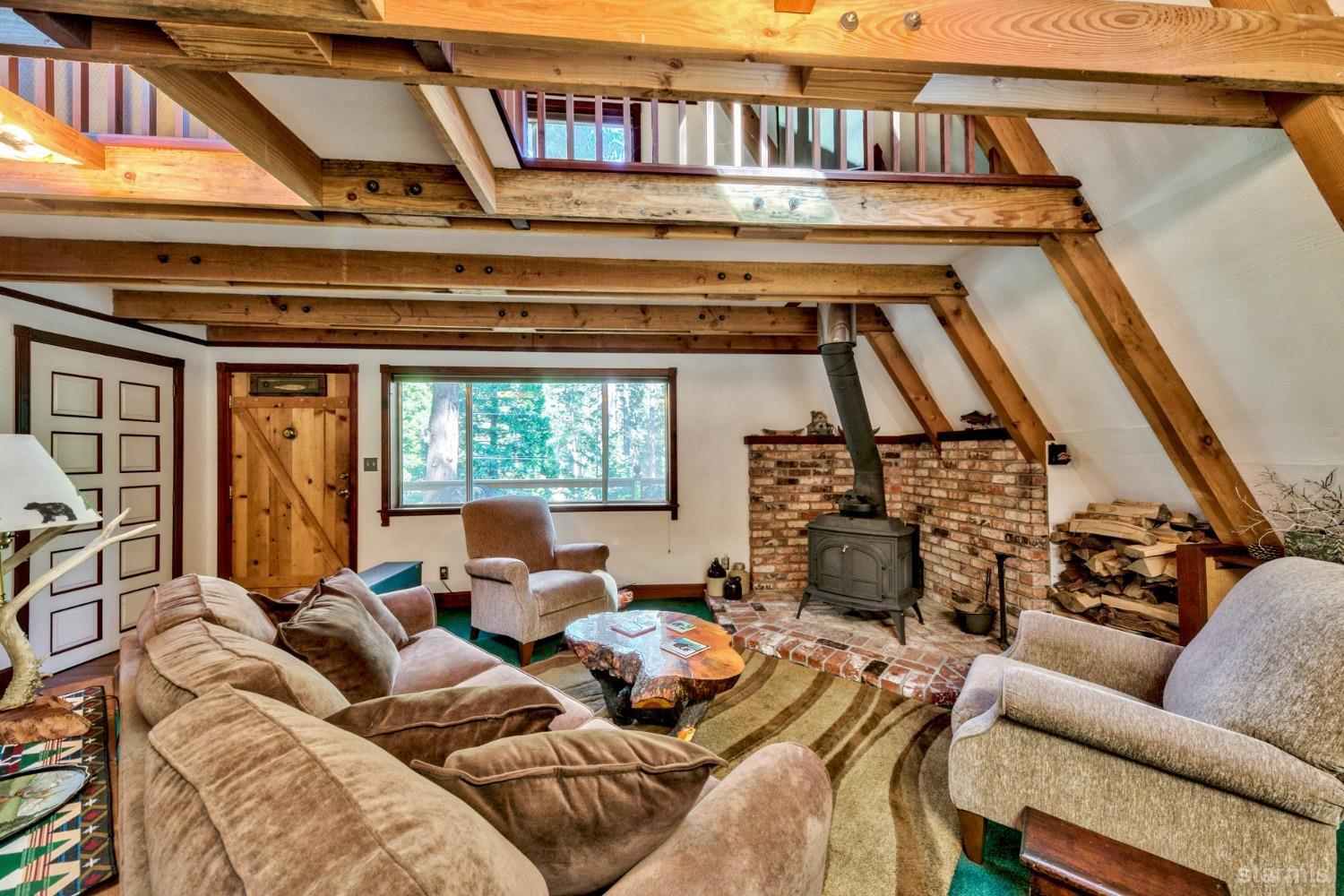1085 Cooks Spur Road Twin Bridges, CA 95735 - Photo 11 of 30 a living room with furniture and a book shelf