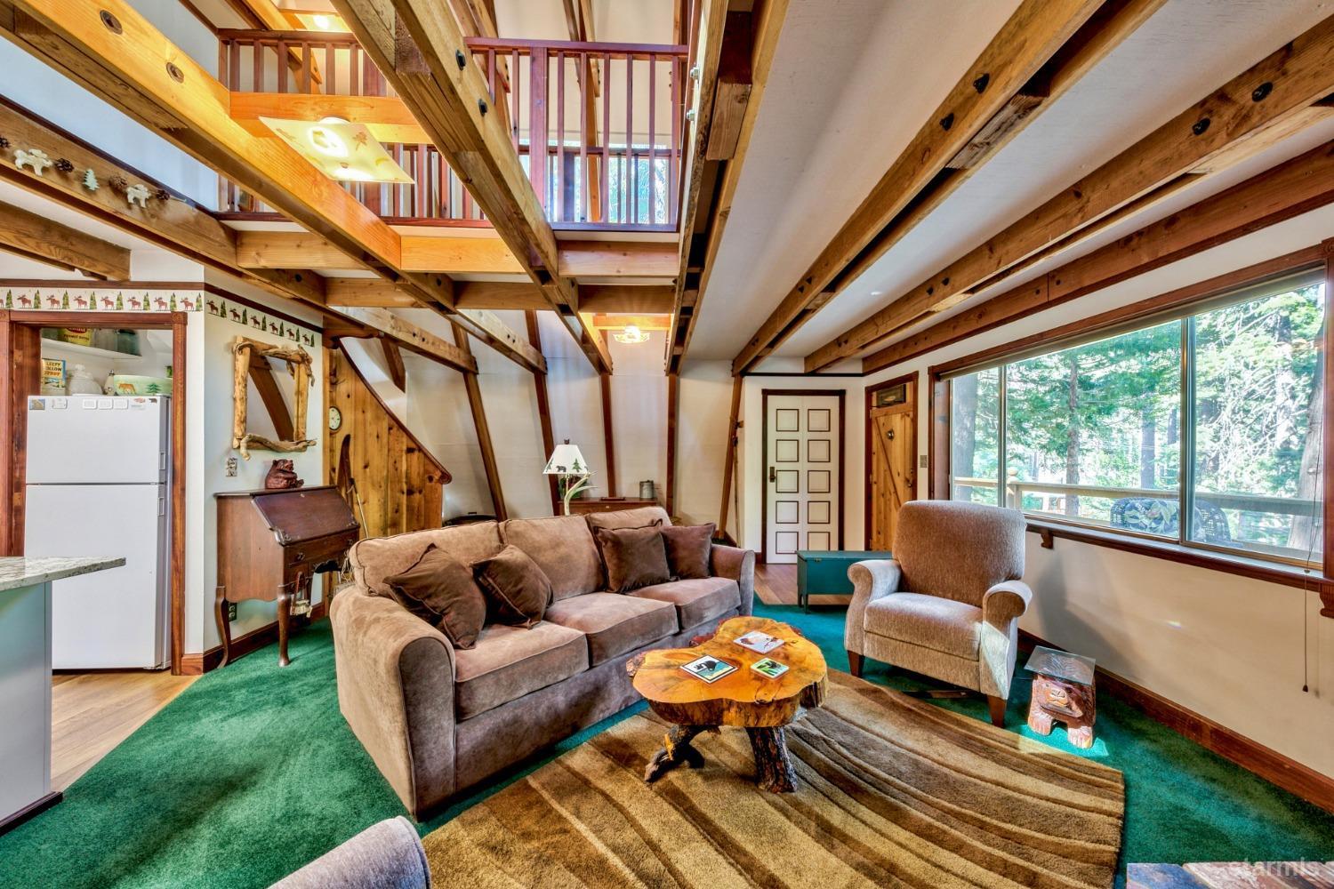 1085 Cooks Spur Road Twin Bridges, CA 95735 - Photo 12 of 30 a living room with furniture and a large window