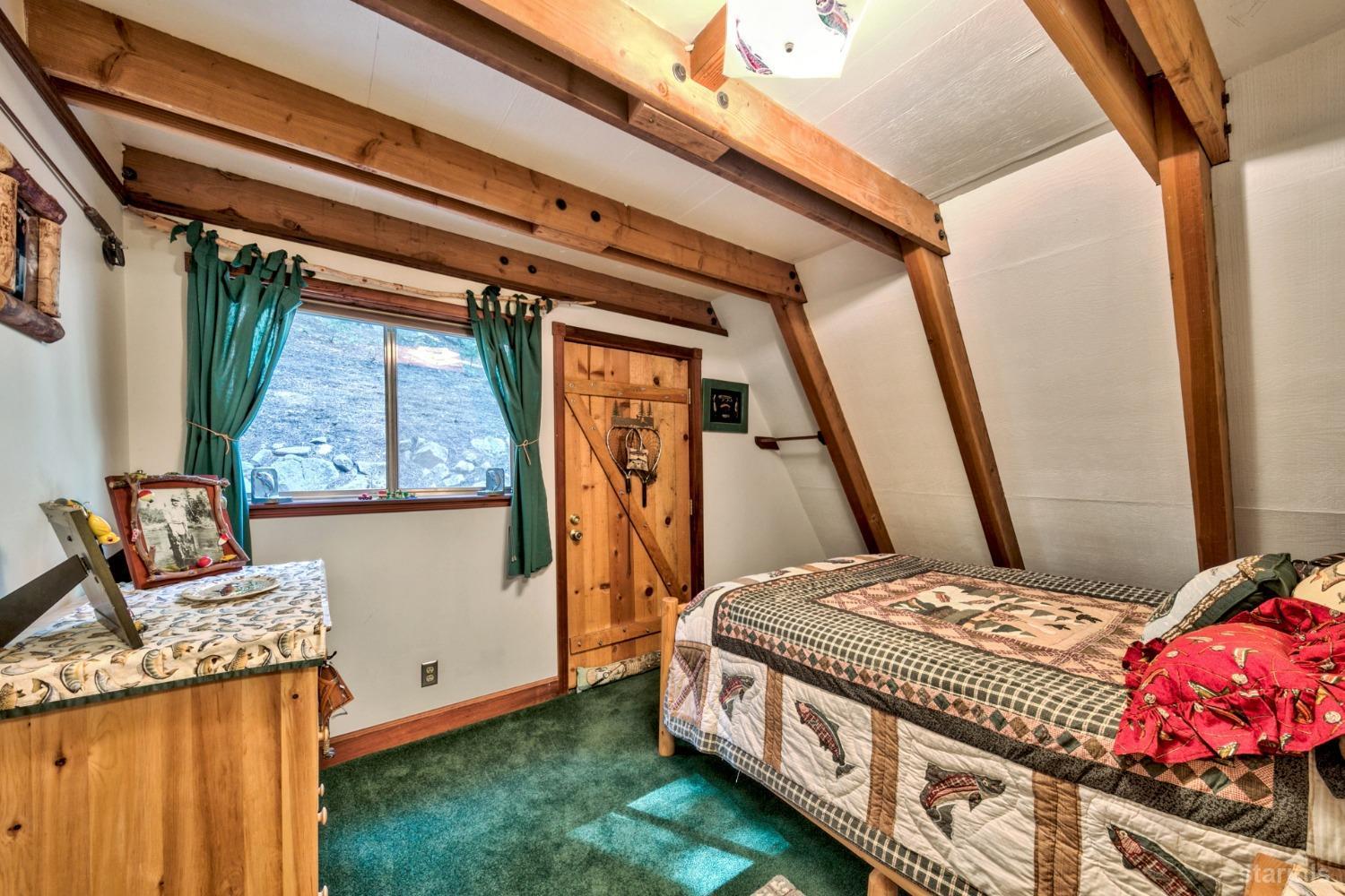 1085 Cooks Spur Road Twin Bridges, CA 95735 - Photo 19 of 30 a bedroom with a bed and a window