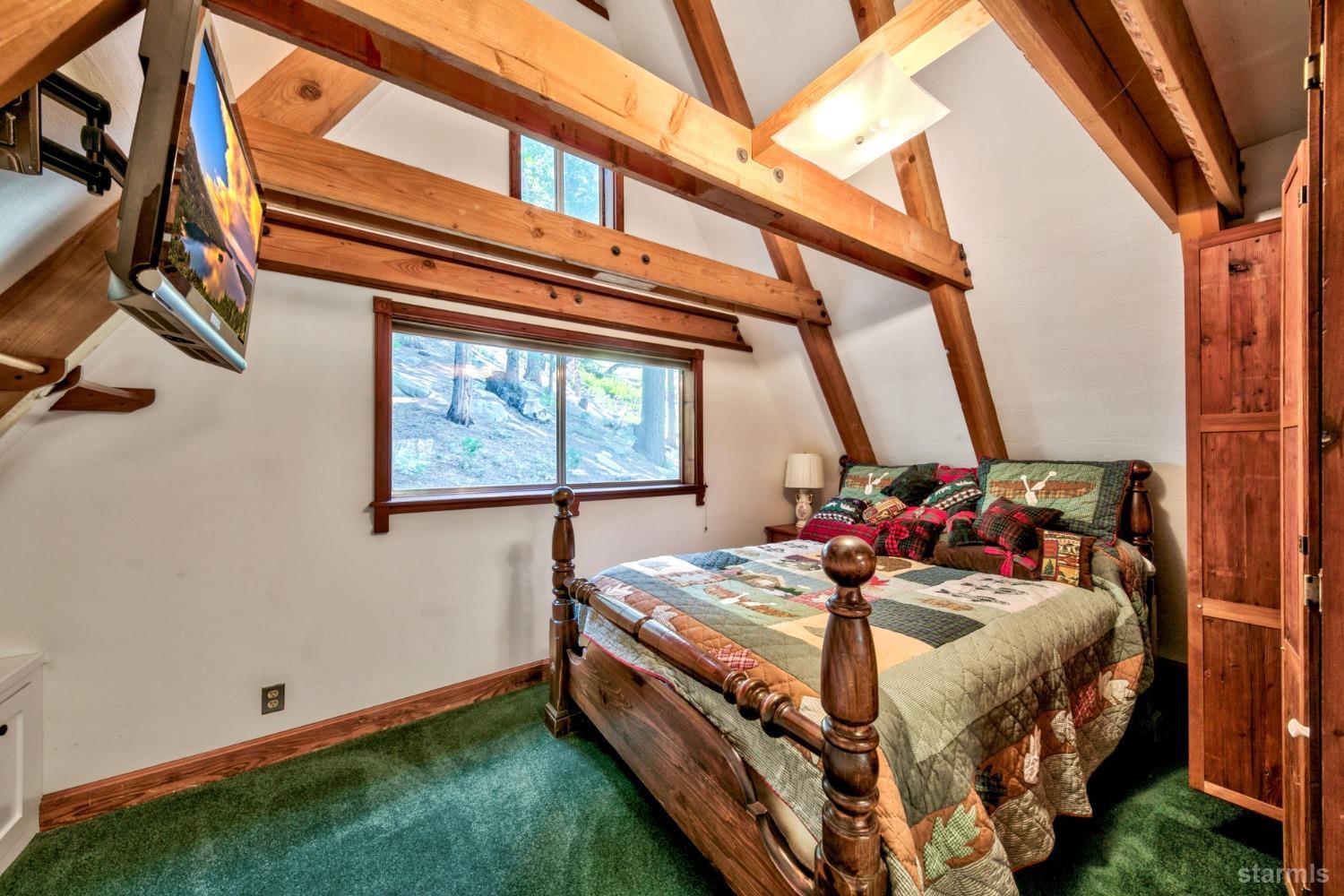 1085 Cooks Spur Road Twin Bridges, CA 95735 - Photo 25 of 30 a bed sitting in a bedroom next to a window