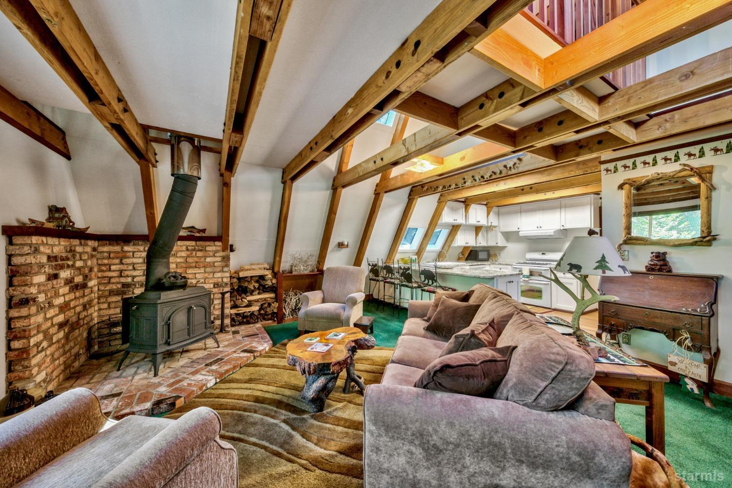 1085 Cooks Spur Road Twin Bridges, CA 95735 - Photo 10 of 30 a living room with furniture and a floor to ceiling window