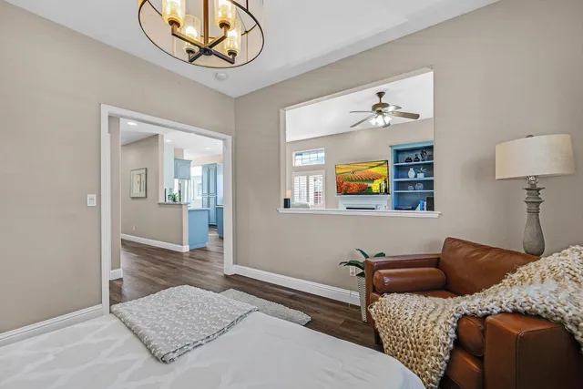 a bathroom with a sink a potted plant a toilet and shower