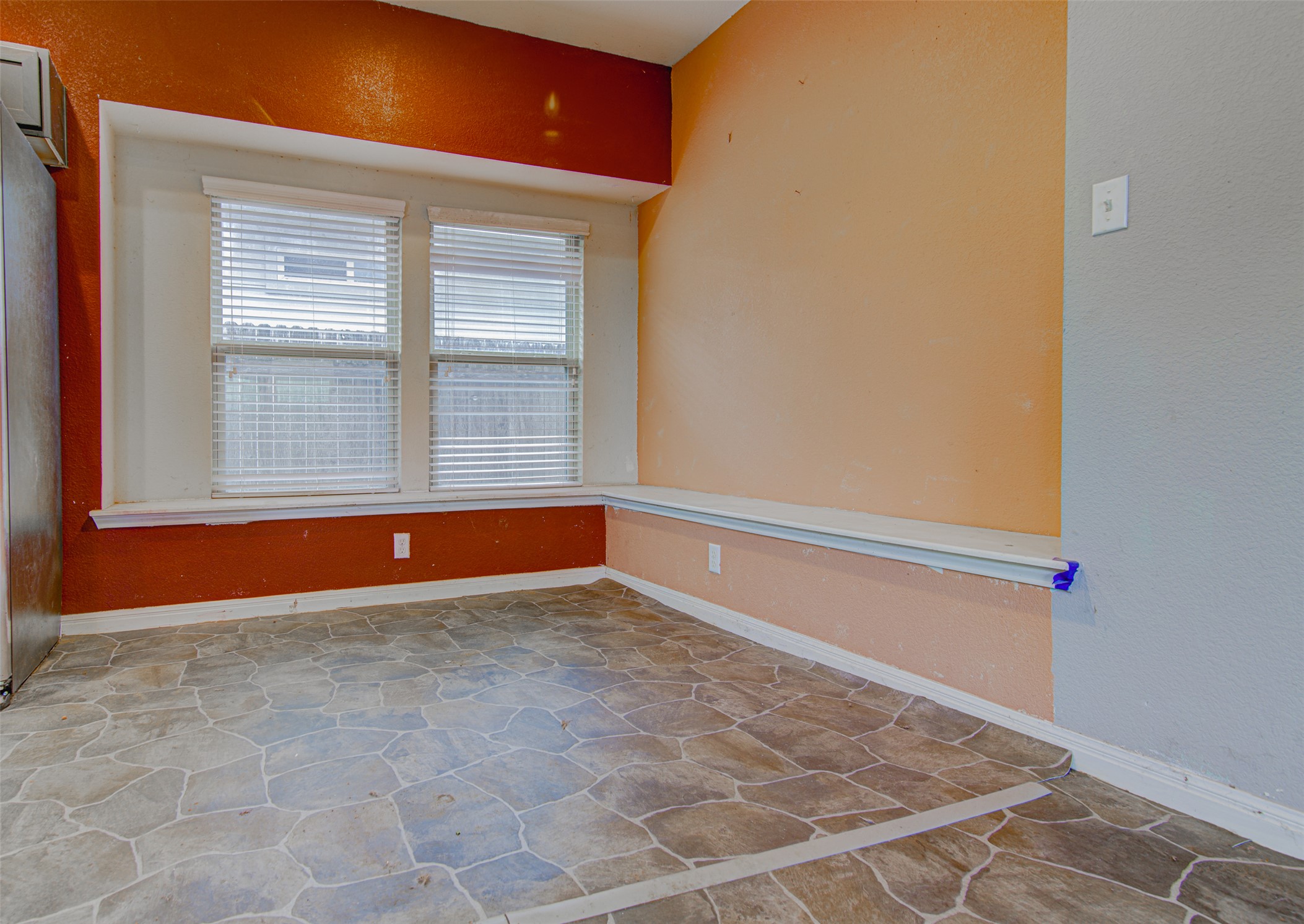 4527 Kind Way, Unit 231 Austin, TX 78725 - Photo 5 of 18 Dual window light source, vinyl flooring, baseboard trim, and a built-in window ledge