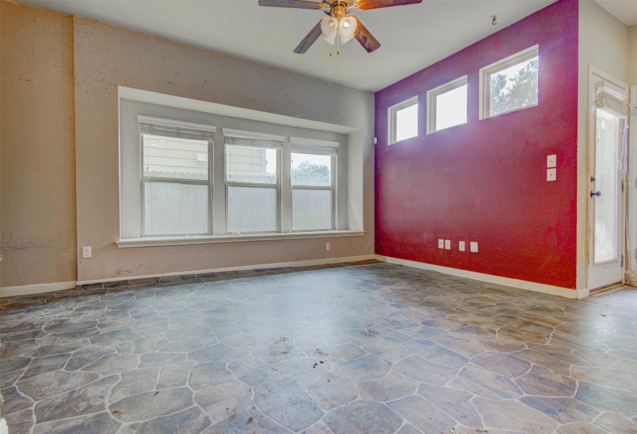 4527 Kind Way, Unit 231 Austin, TX 78725 - Photo 6 of 18 Spacious interior room featuring a vaulted ceiling and a ceiling fan with integrated lighting