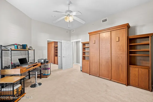 a view of a livingroom with furniture and chandelier