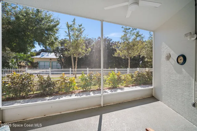a view of a porch and a yard