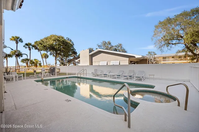 a view of a swimming pool with a patio