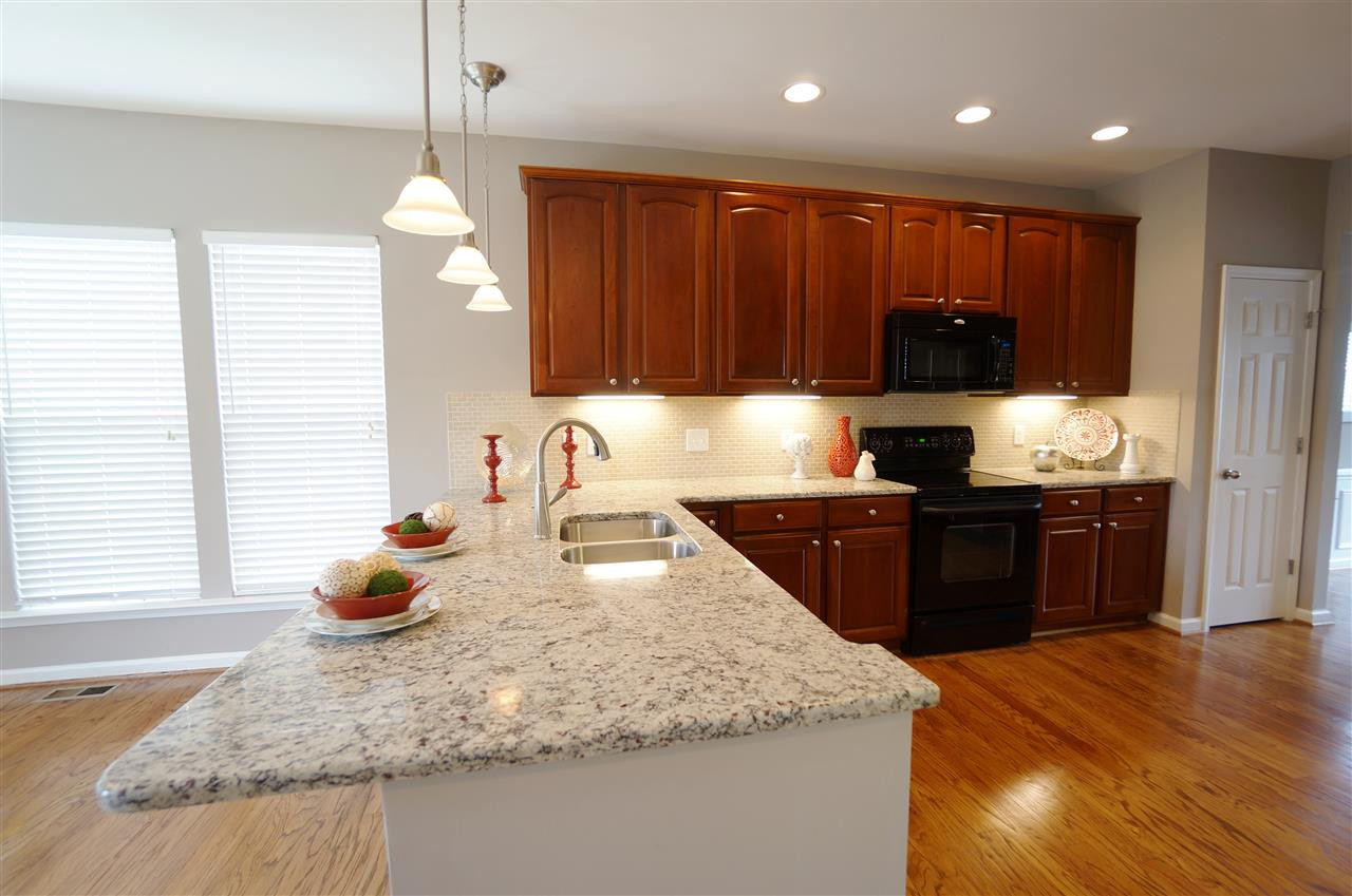 7730 San Gabriel Street Raleigh, NC 27613 - Photo 8 of 25 Rich textures & clean design make this kitchen very welcoming & inviting. Kitchen