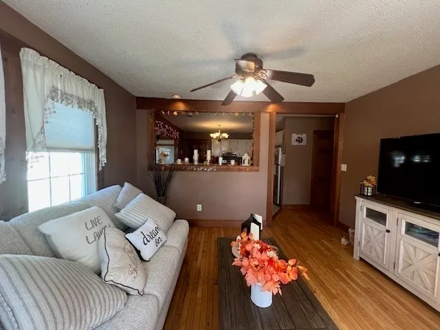 a kitchen with stainless steel appliances granite countertop a sink a stove top oven a counter space and cabinets