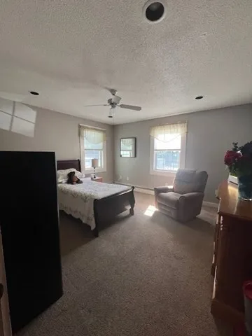 a kitchen with stainless steel appliances kitchen island granite countertop a sink and cabinets