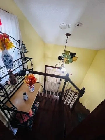 a kitchen with stainless steel appliances a sink counter space and chairs