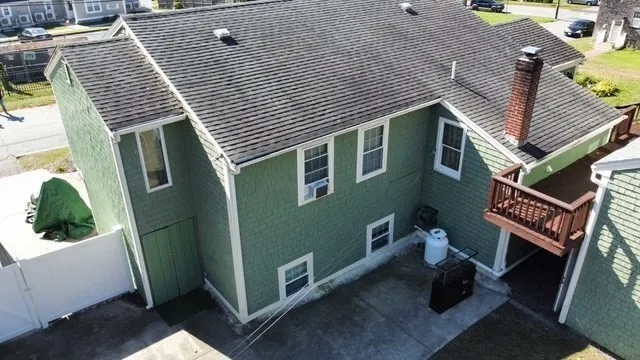 a view of a balcony with wooden floor