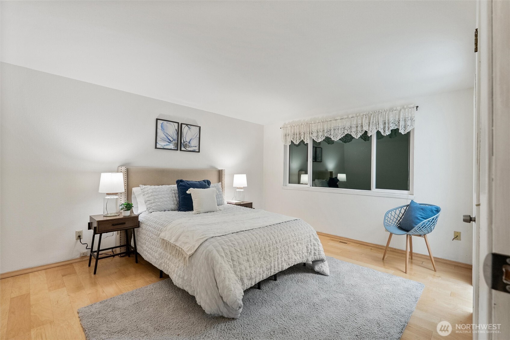 15618 Southeast 174th Street Renton, WA 98058 - Photo 11 of 28 a bedroom with a bed and a lamp next to a window