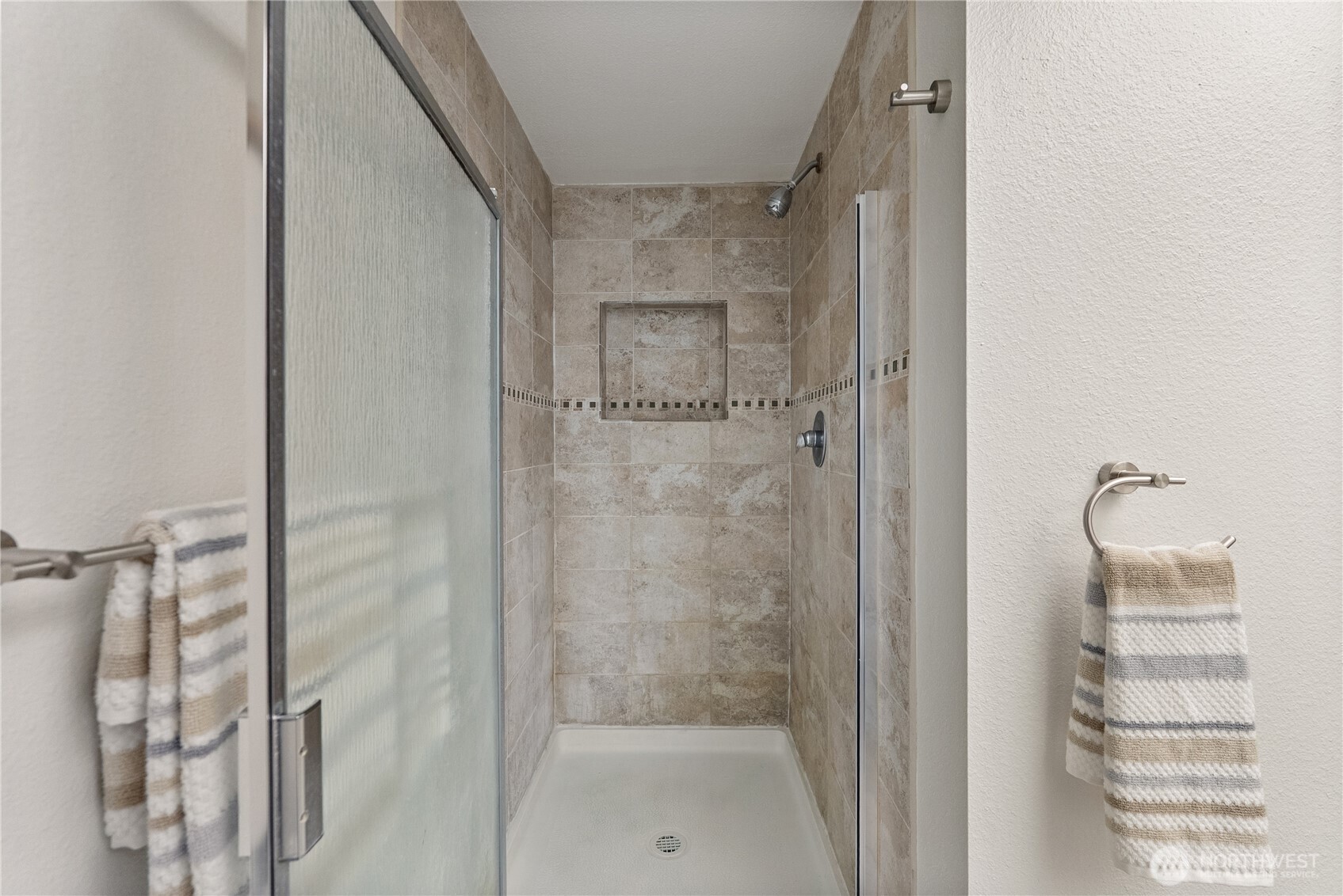 15618 Southeast 174th Street Renton, WA 98058 - Photo 14 of 28 a bathroom with a shower