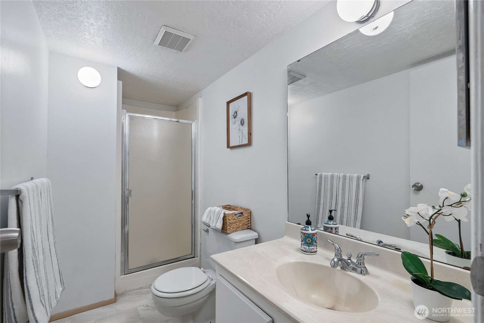 15618 Southeast 174th Street Renton, WA 98058 - Photo 22 of 28 a bathroom with a sink toilet and shower