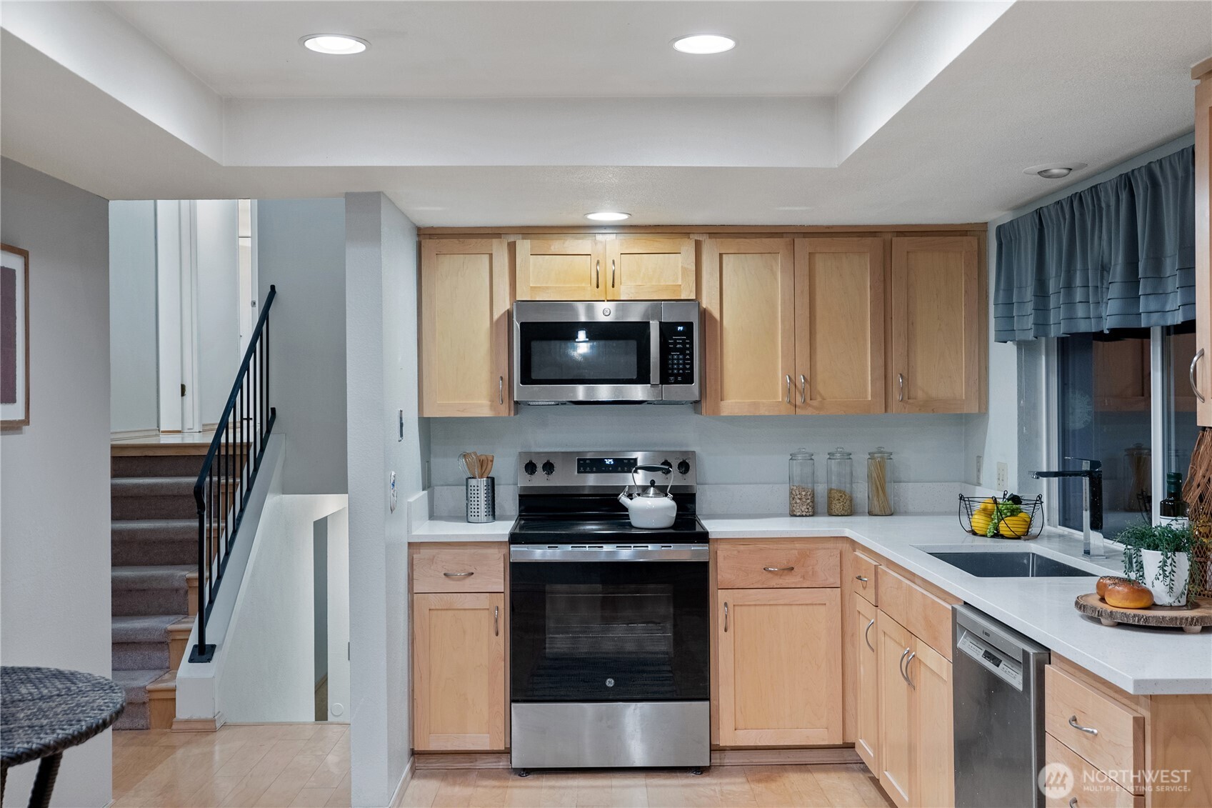 15618 Southeast 174th Street Renton, WA 98058 - Photo 9 of 28 a kitchen with a sink a stove and cabinets