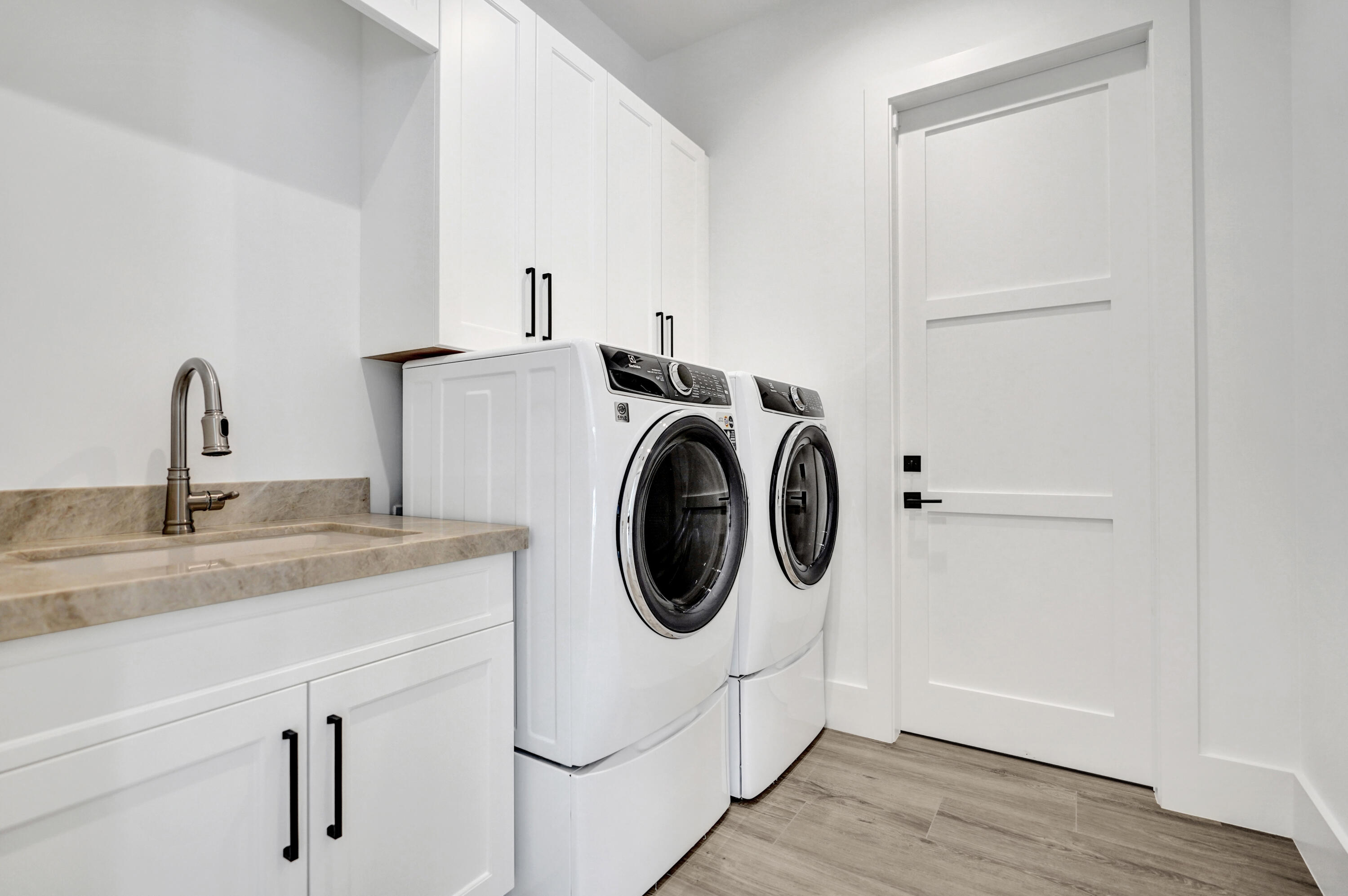 4451 Northeast 27th Terrace Lighthouse Point, FL 33064 - Photo 26 of 38 a utility room with sink dryer and washer