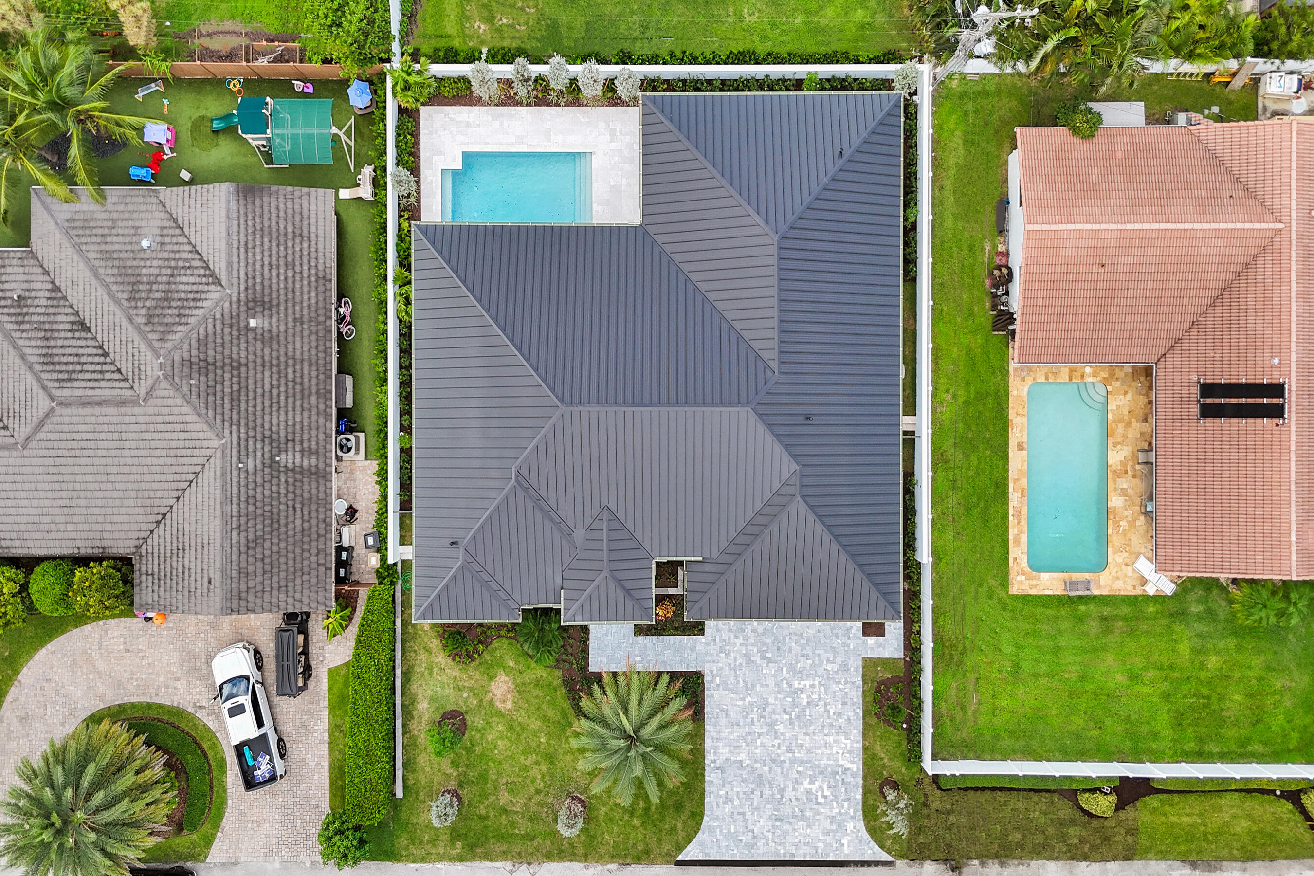 4451 Northeast 27th Terrace Lighthouse Point, FL 33064 - Photo 36 of 38 a aerial view of a house with garden