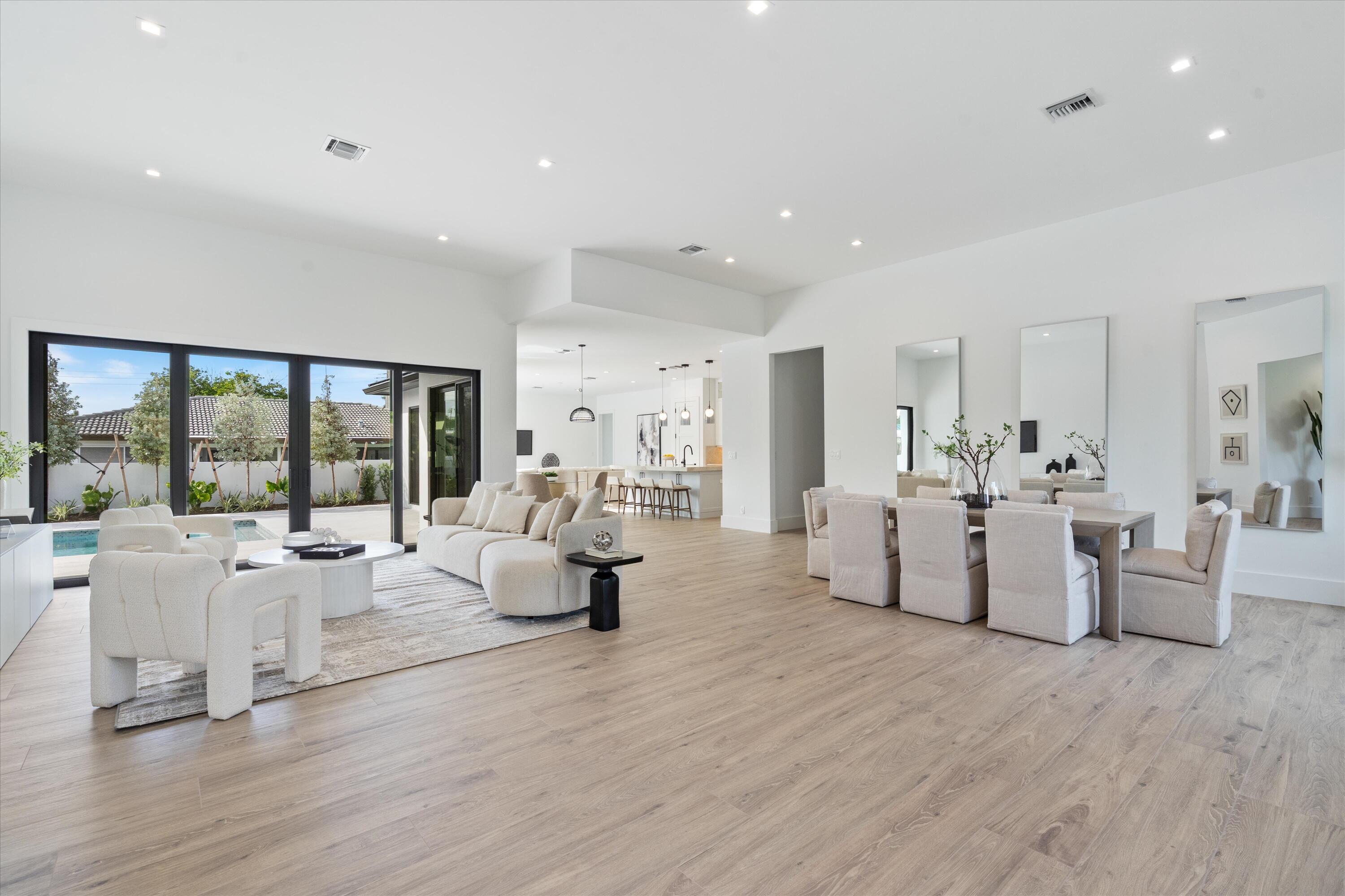 4451 Northeast 27th Terrace Lighthouse Point, FL 33064 - Photo 7 of 38 a living room with furniture and a large window