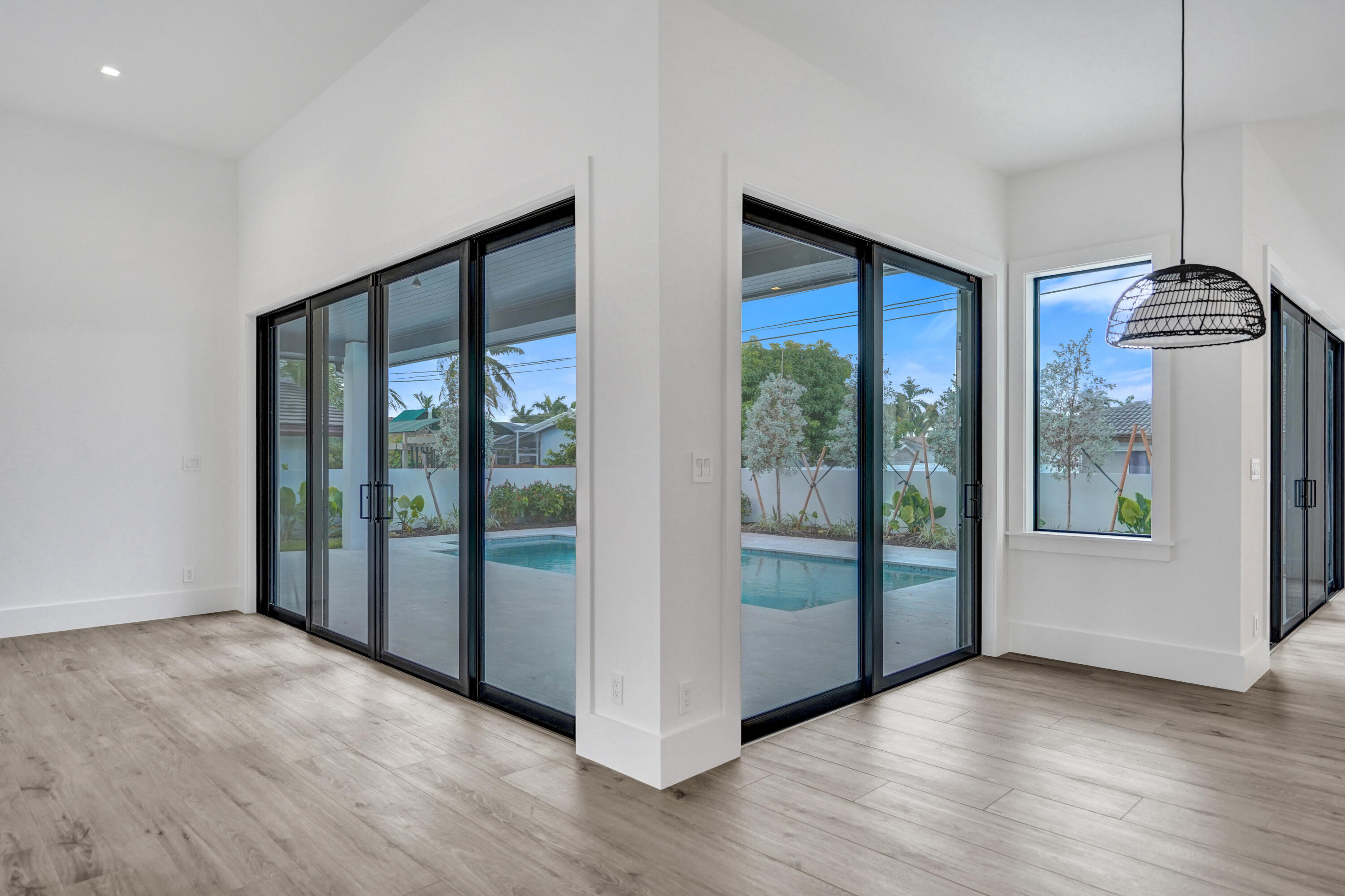 4451 Northeast 27th Terrace Lighthouse Point, FL 33064 - Photo 8 of 38 a view of an empty room with glass door