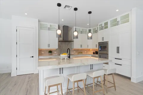 a bedroom with bed and wall painting