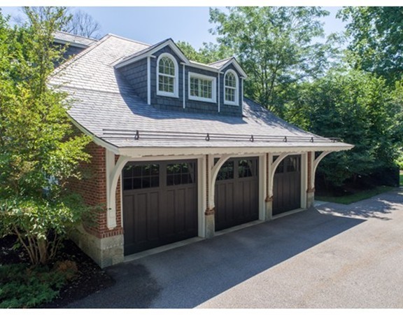 65 Lenox Street Newton, MA 02465 - Photo 13 of 16 a front view of a house with a garage