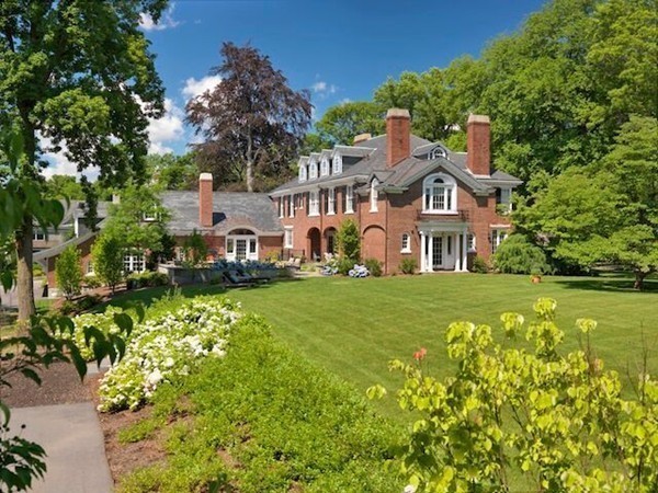 65 Lenox Street Newton, MA 02465 - Photo 9 of 16 a front view of a house with a big yard