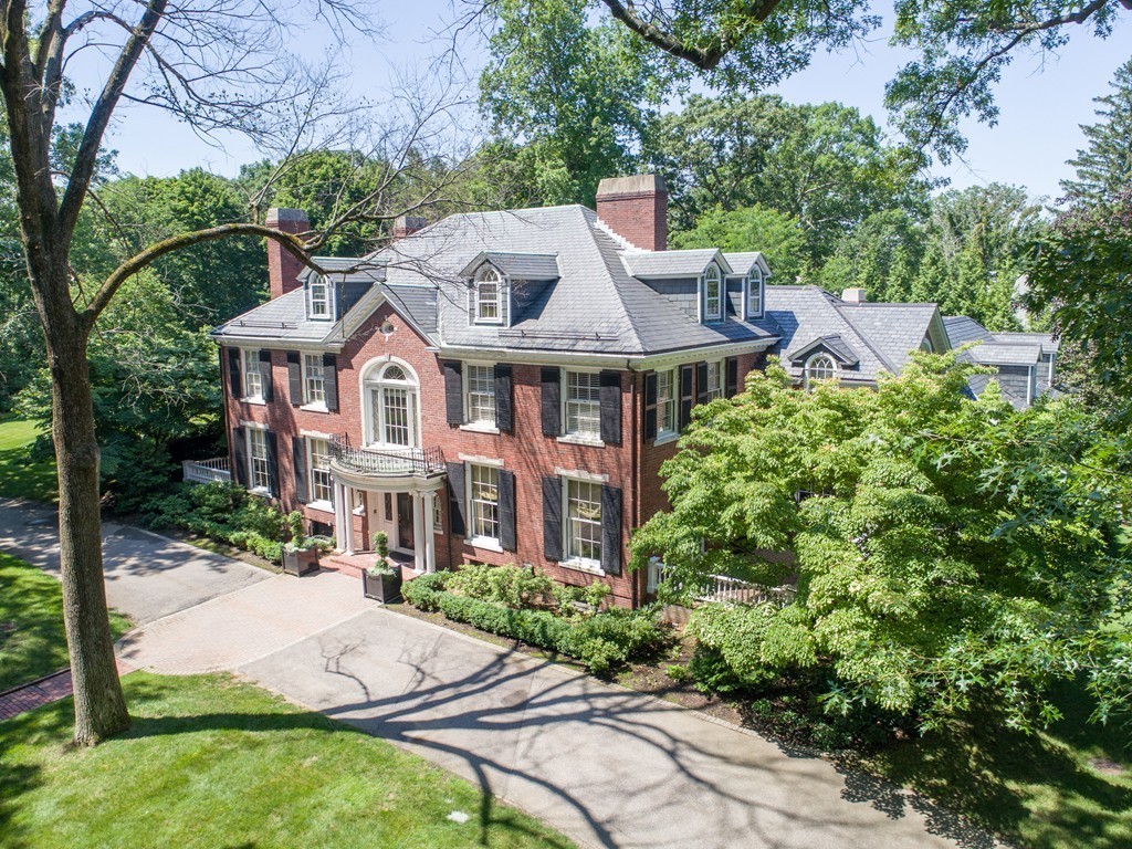 65 Lenox Street Newton, MA 02465 - Photo 10 of 16 a patio with sofas fire pit table and chairs