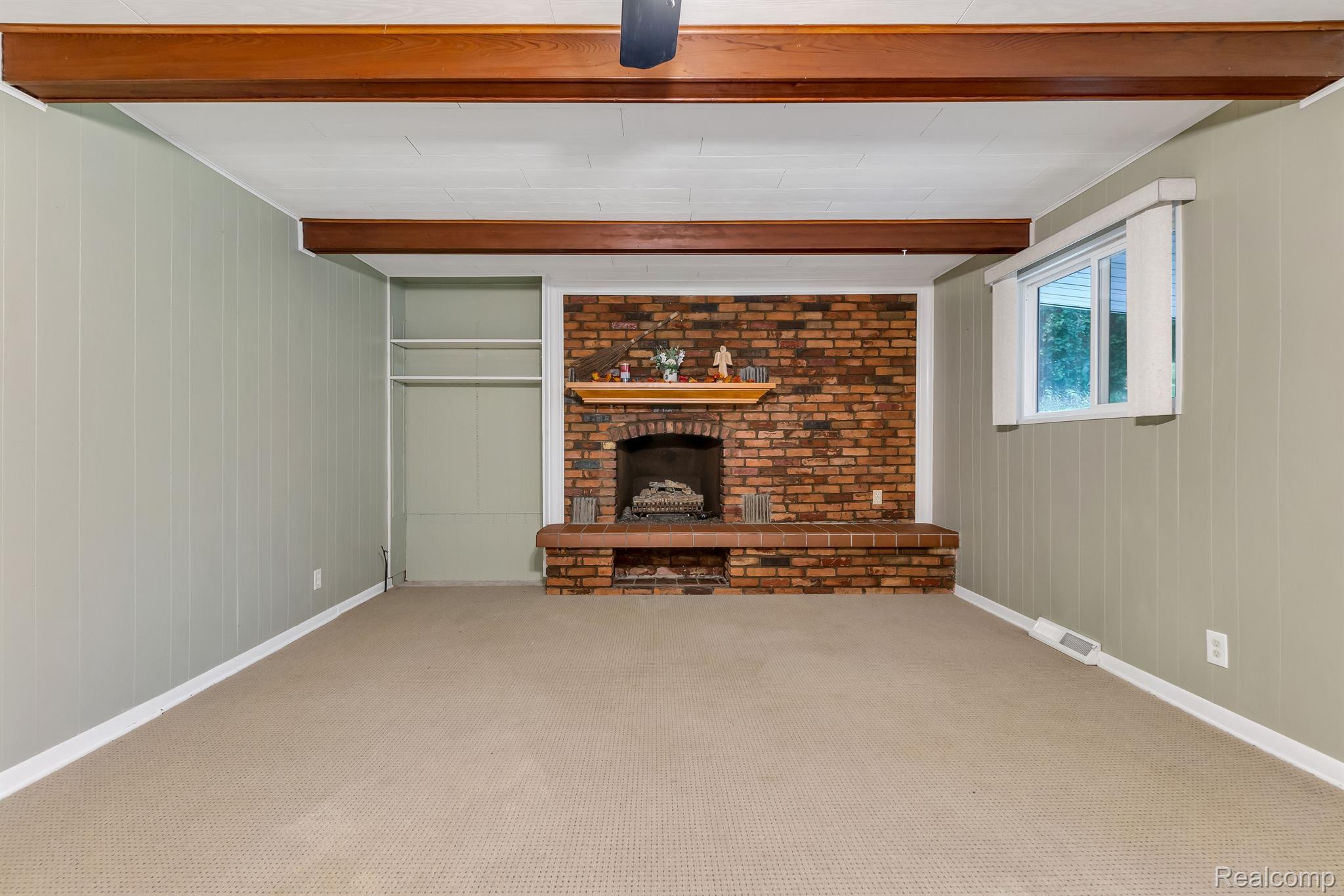 16068 Fish Lake Road Holly, MI 48442 - Photo 25 of 44 Family Room with cozy gas fireplace