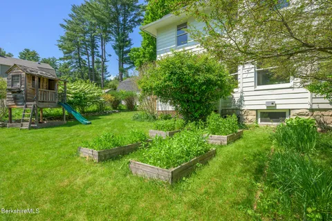 a house view with a garden space