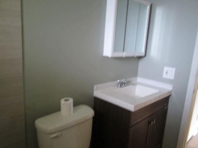 1911 Northeast 27th Court, Unit 13 Lighthouse Point, FL 33064 - Photo 42 of 61 a bathroom with a sink and a toilet