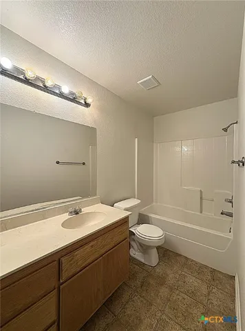 a bathroom with a double vanity sink toilet and shower