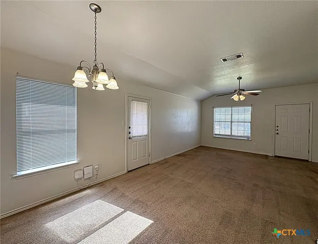 a view of a windows and chandelier in a room