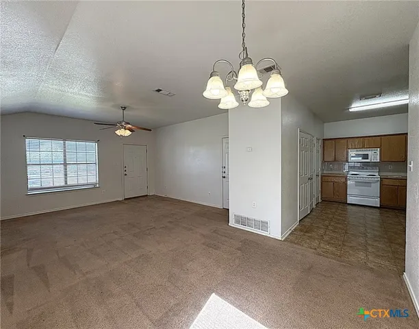a view of a kitchen with a sink and dishwasher