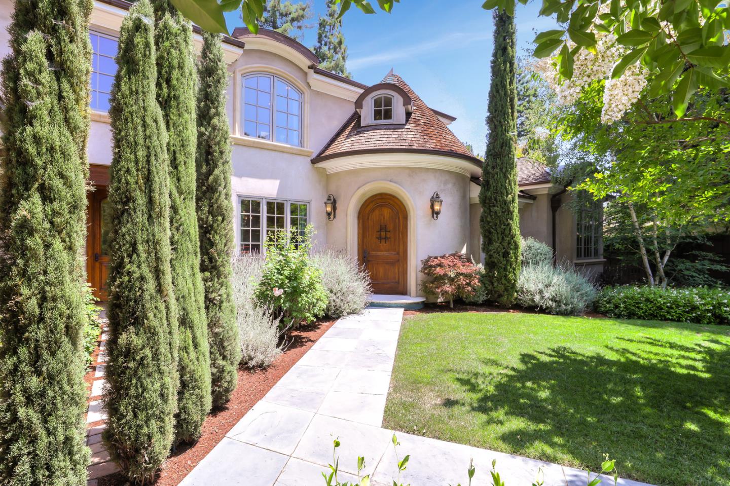 1020 Windsor Drive Menlo Park, CA 94025 - Photo 2 of 18 a front view of a house with garden