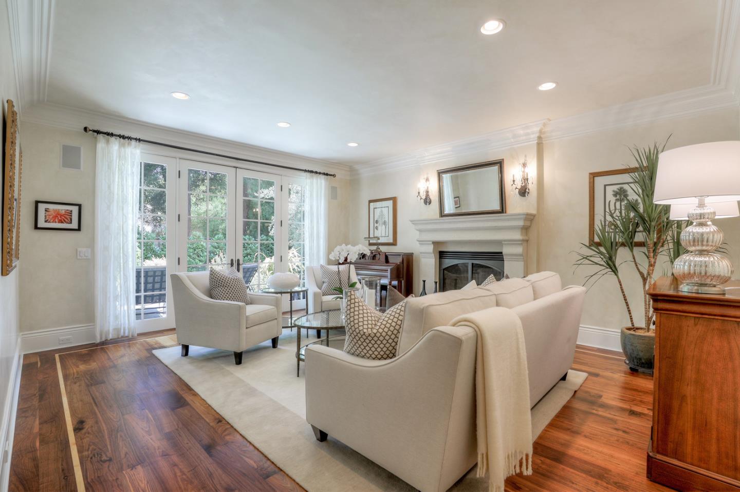 1020 Windsor Drive Menlo Park, CA 94025 - Photo 3 of 18 a living room with fireplace furniture and a large window