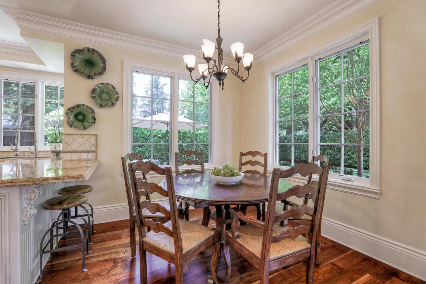 1020 Windsor Drive Menlo Park, CA 94025 - Photo 7 of 18 a view of a dining room with furniture a chandelier and wooden floor