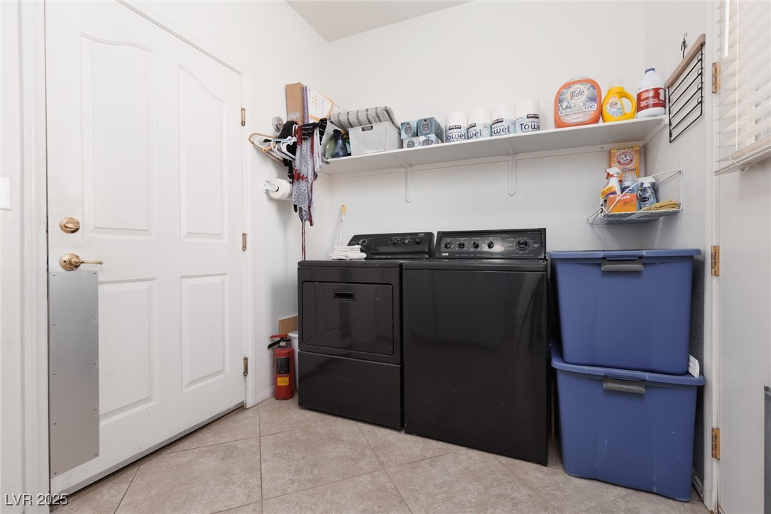 99 Milicity Road Henderson, NV 89012 - Photo 20 of 51 Washroom with light tile patterned floors and washing machine and clothes dryer