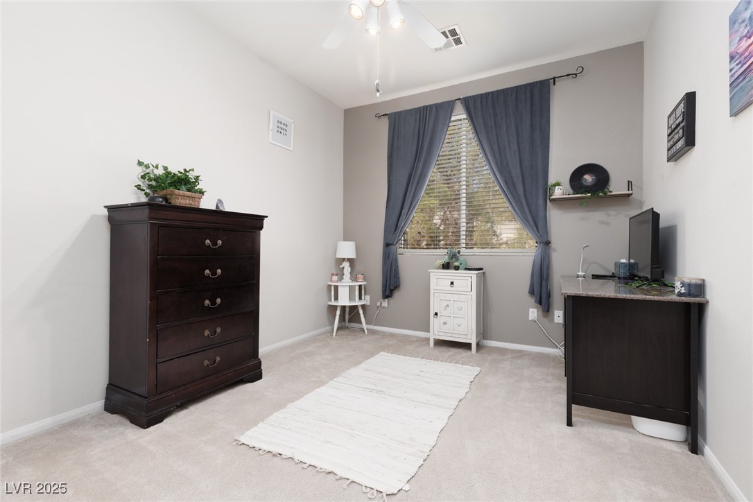 99 Milicity Road Henderson, NV 89012 - Photo 26 of 51 Home office with light carpet and a ceiling fan