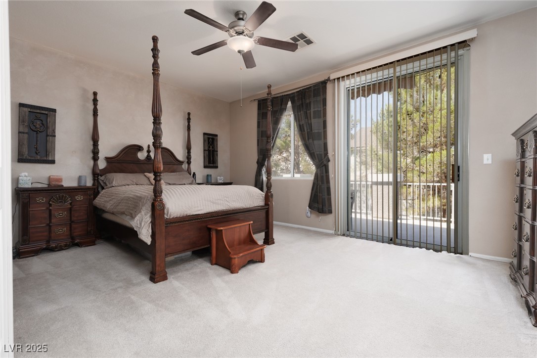99 Milicity Road Henderson, NV 89012 - Photo 28 of 51 Carpeted bedroom with access to exterior and ceiling fan