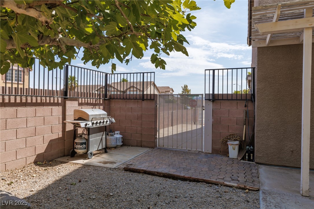 99 Milicity Road Henderson, NV 89012 - Photo 39 of 51 Gate with a patio area