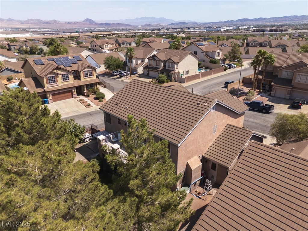 99 Milicity Road Henderson, NV 89012 - Photo 45 of 51 Aerial perspective of suburban area with mountains