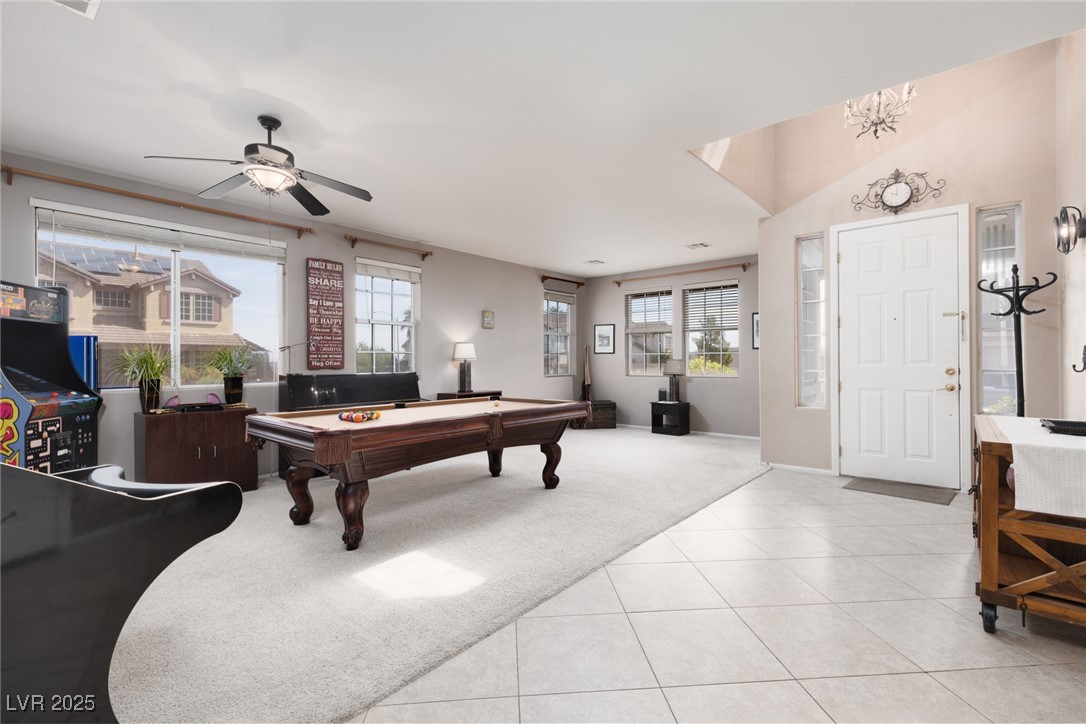 Recreation room with light carpet, pool table, and light tile patterned flooring