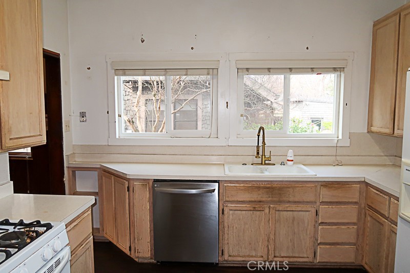 1239 Broadway Street Chico, CA 95928 - Photo 11 of 36 a kitchen with stainless steel appliances granite countertop a sink stove and cabinets