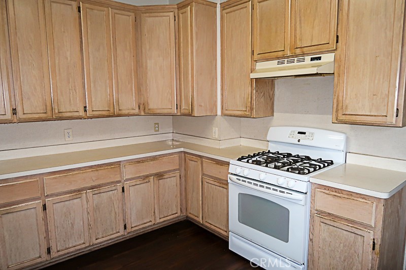 1239 Broadway Street Chico, CA 95928 - Photo 13 of 36 a kitchen with granite countertop white cabinets and white appliances