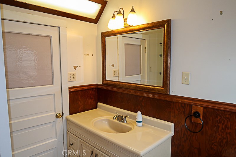 1239 Broadway Street Chico, CA 95928 - Photo 17 of 36 a bathroom with a sink vanity and mirror