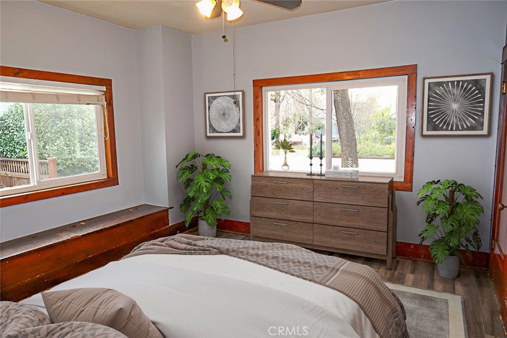 1239 Broadway Street Chico, CA 95928 - Photo 18 of 36 a bedroom with a bed and a potted plant