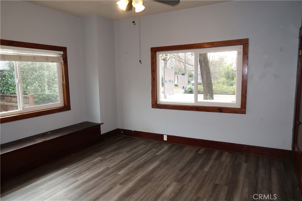 1239 Broadway Street Chico, CA 95928 - Photo 19 of 36 a view of an empty room with wooden floor and a window