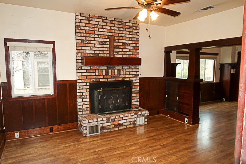 1239 Broadway Street Chico, CA 95928 - Photo 2 of 36 a living room with furniture mirror and a fireplace